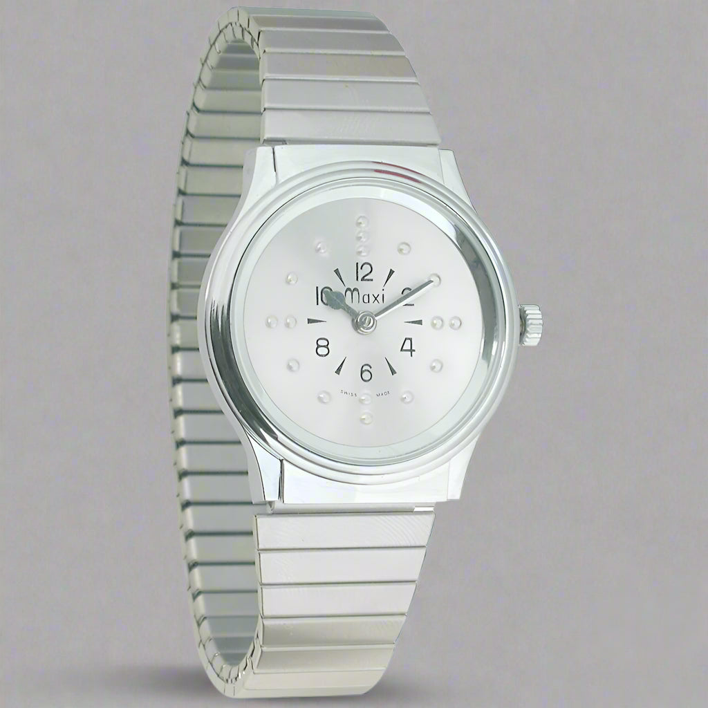 A silver-colored analog watch with a metallic expansion band and a clear crystal face displaying black numerals and a silver tone expansion band.