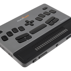 New Products - HumanWare Braille device with tactile buttons and display for low vision assistance.