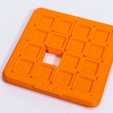3D Braille sliding puzzle game in orange, featuring raised Braille dots for tactile play, 4x4 inch design.