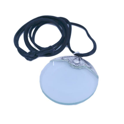 Turquoise pendant magnifier with silver-tone metal frame and black cord, offering 4X magnification for stylish utility.