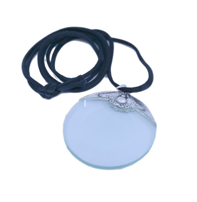 Turquoise pendant magnifier with silver-tone metal frame and black cord, offering 4X magnification for stylish utility.