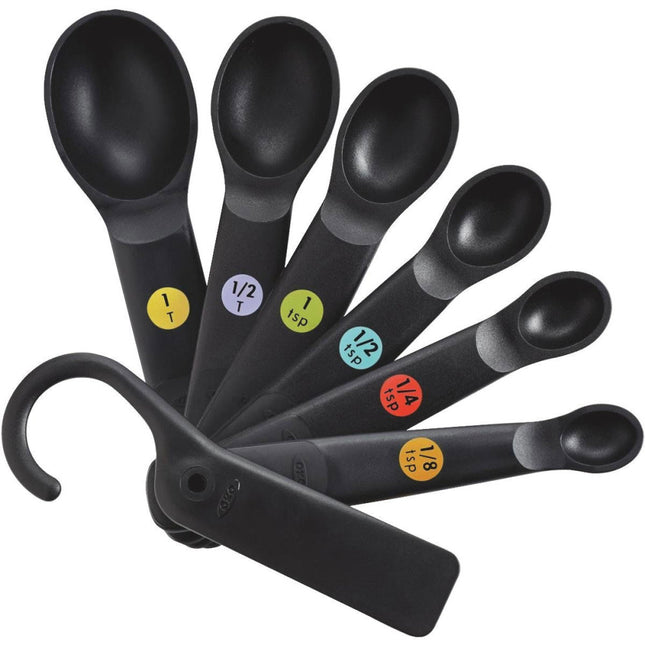 Good Grips non-slip measuring spoon set in black, featuring bright, color-coded permanent measurements for easy use.
