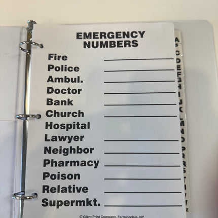 Large print address book for low vision emergency numbers page with readable text.