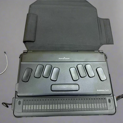 used BrailleNote Touch 32 Plus Braille note taker tablet with 32-cell Braille display and tactile keyboard on desk