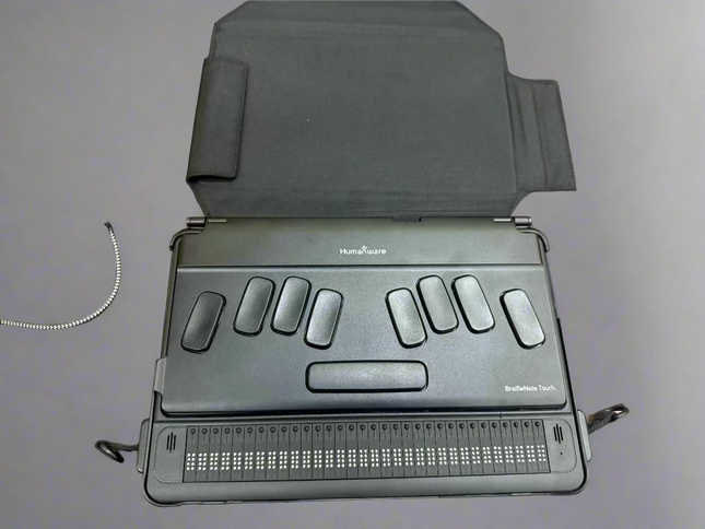 used BrailleNote Touch 32 Plus Braille note taker tablet with 32-cell Braille display and tactile keyboard on desk