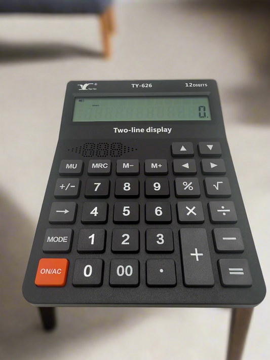 Black calculator with a two-line display on a white background