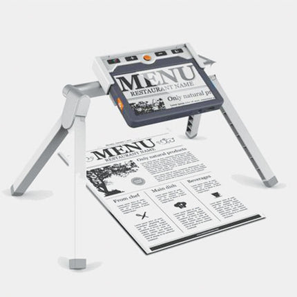 Clover 7 portable video magnifier showcasing a menu on a table, highlighting its adjustable assist stand for easy viewing.