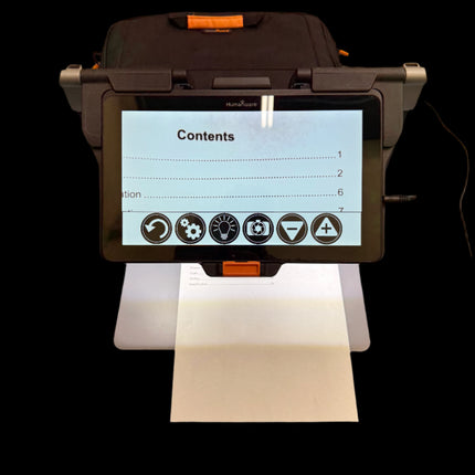 Used HumanWare Connect 12 video magnifier displaying text on paper with touchscreen interface.