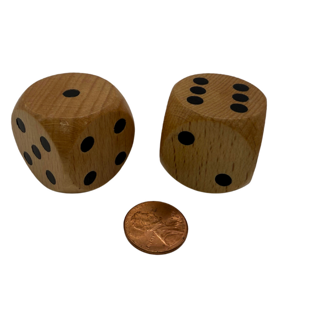 Large Jumbo 30mm Rounded Wood Dice with Black Numbers displayed next to a penny for size comparison.