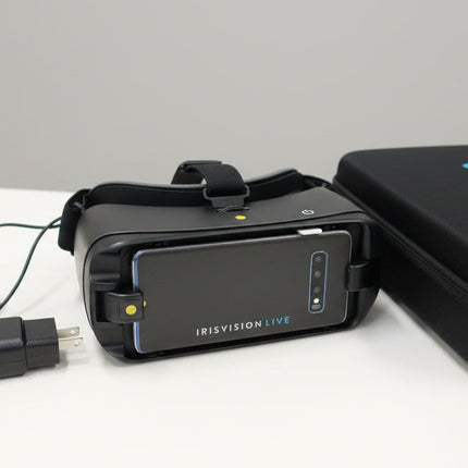 Used IRIS-Head Worn Video Magnifiers Samsung S 10 with charger and case on a table.