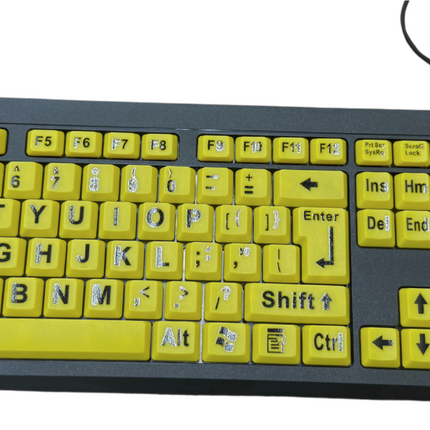 Large print computer keyboard with yellow keys and black letters for improved visibility and ease of use.
