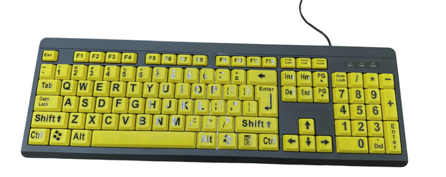Large print computer keyboard with yellow keys and black letters for improved visibility and ease of use.