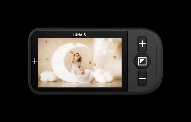 Luna S handheld video magnifier displaying a girl with a crescent moon backdrop.