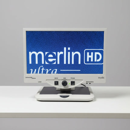 A Merlin Ultra HD monitor and tracking unit setup in a workshop or studio environment.