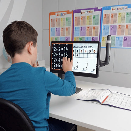 Child using Mirror Pad Pro, a 3-in-1 wireless magnifier, to view and solve math problems on a screen.