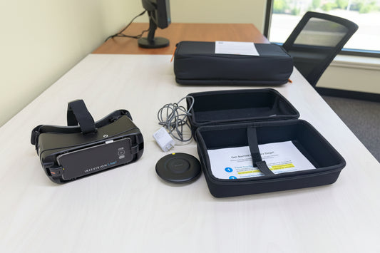 VR headset, controller, and accessories on a wooden table