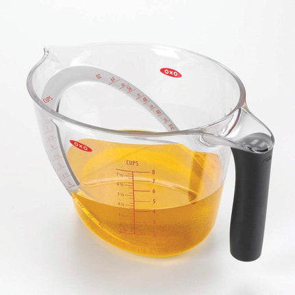 Angled Measuring Cup Set by OXO, featuring a clear design with measurement markings and a non-slip handle.