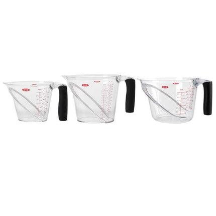Angled measuring cup set - 3 clear plastic measuring cups with black handles for easy liquid measurement.