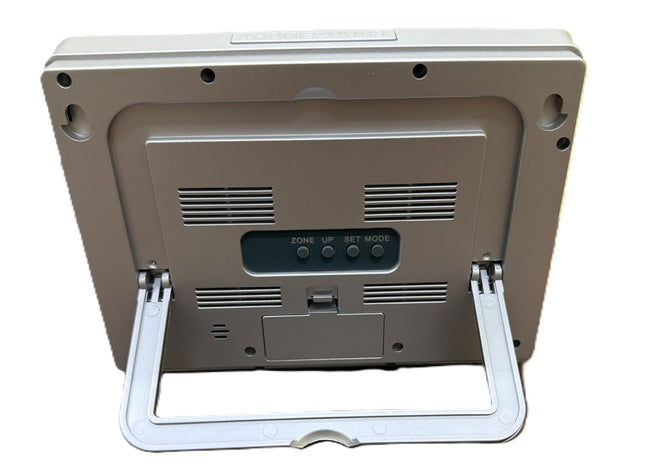 Back view of the Atomic 2-inch LCD number clock showing buttons and stand for easy placement.