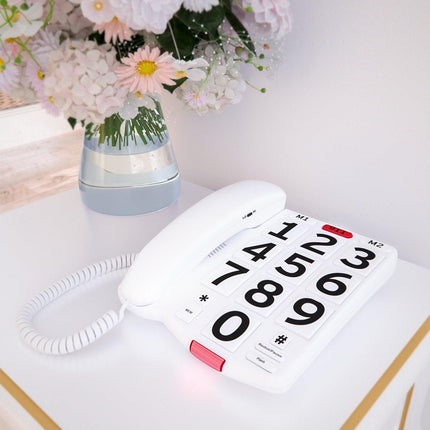 Big Button Telephone with Speed Dial on a white table, featuring large easy-to-press buttons and a stylish design.