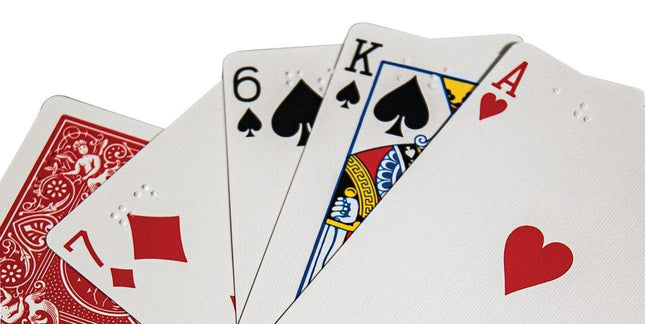 Braille Playing Cards in one CORNER featuring playing cards with braille symbols for inclusivity.