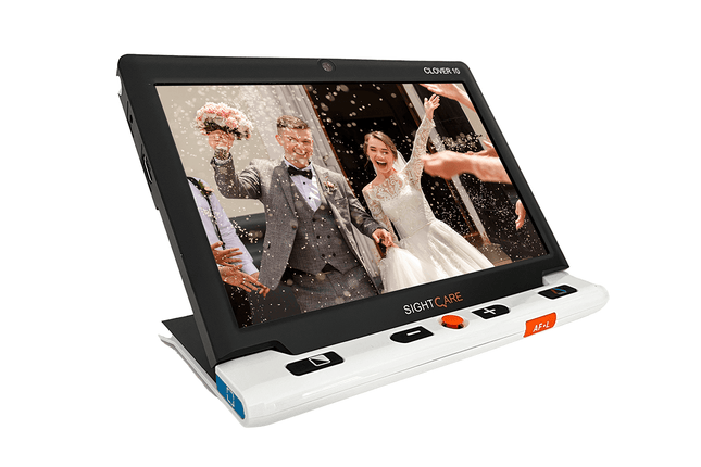 Clover 10 HD video magnifier with optional stand displaying a wedding scene on a 10 inch anti-glare screen.
