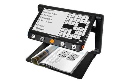 CloverBook LITE video magnifier showing crossword puzzle and text on a 12.5-inch touchscreen display.