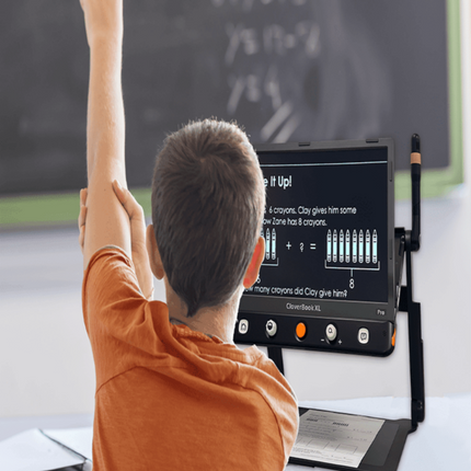 Student using the CloverBook Pro XL 16" video magnifier with distance viewing in a classroom.