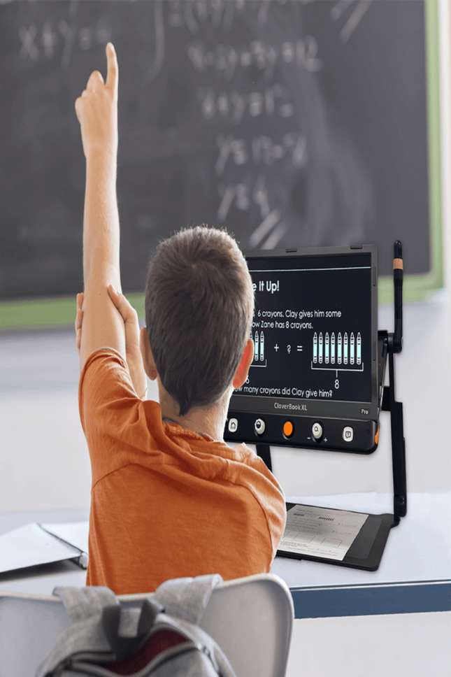 Student using the CloverBook Pro XL 16" video magnifier with distance viewing in a classroom.