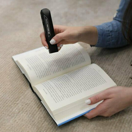 Used OrCam Read text to speech device scanning text in a book.