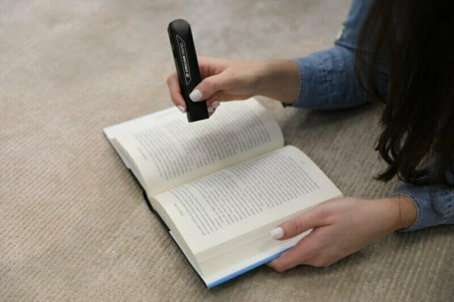 Used OrCam Read text to speech device scanning text in a book.
