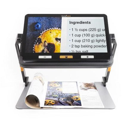 Portable video magnifier for low vision displaying recipe ingredients on a large touchscreen.