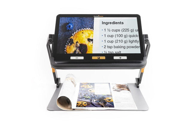 Portable video magnifier for low vision displaying recipe ingredients on a large touchscreen.