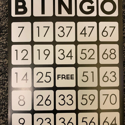 Large print bingo cards showing a traditional bingo layout with numbers and a free space.