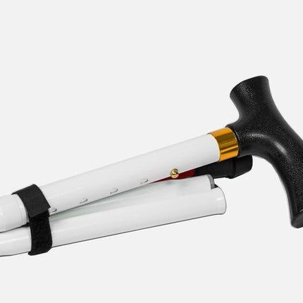 Folding adjustable support cane with a T-handle, folded and secured with a Velcro strap for easy carrying.