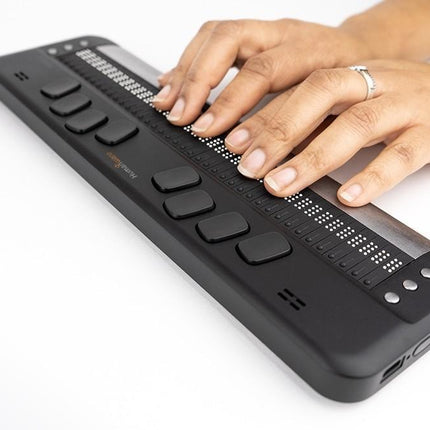 Humanware Brailliant BI 40X braille display with user typing on the refreshable braille cells.