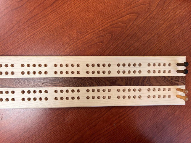 Hand crafted jumbo size cribbage board featuring two player tracks and multiple peg holes.
