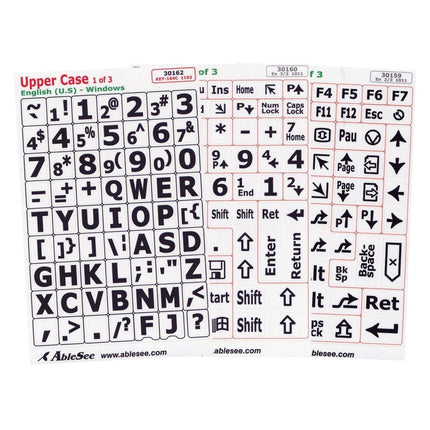 Keyboard labels for low vision featuring black uppercase characters on white stickers for easy typing.