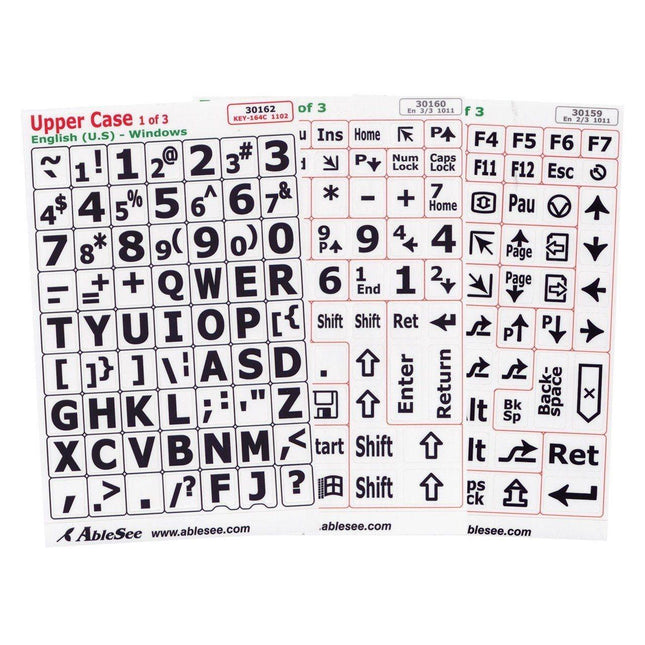 Keyboard labels for low vision featuring black uppercase characters on white stickers for easy typing.