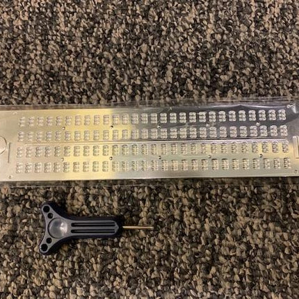 Lightweight metal slate braille board featuring four lines, 28 cells, and a stylus included.
