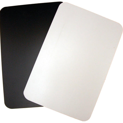 Black and white cutting board for low vision featuring a black side and white side for contrasting light and dark foods.