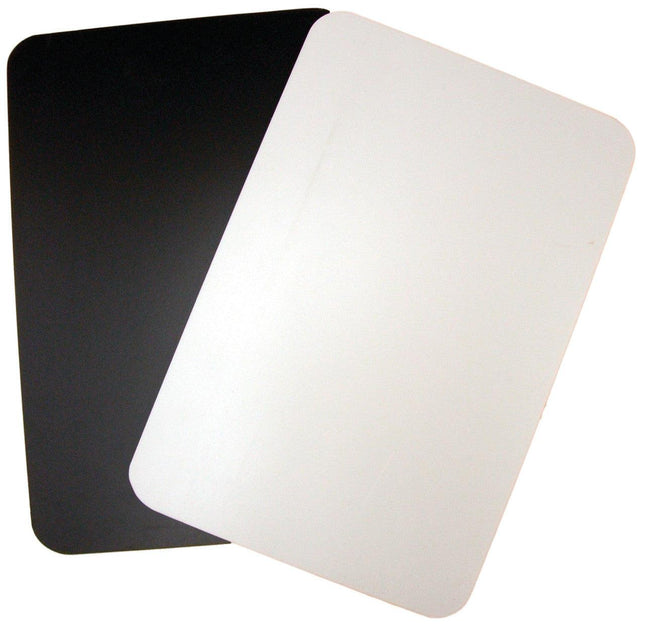 Black and white cutting board for low vision featuring a black side and white side for contrasting light and dark foods.