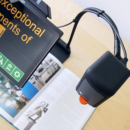 MagniLink TAB tablet solution for distance viewing showcasing a reading magnifier on a book.