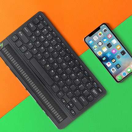 Mantis Q40 Braille Display alongside a smartphone on a colorful background, showcasing its versatile applications.