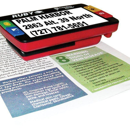 Ruby 4.3" SD Handheld Portable Video Magnifier displaying text on a document for clear reading and viewing.