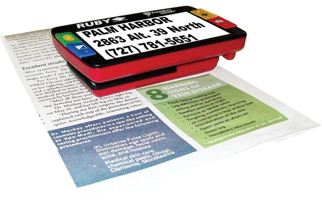 Ruby 4.3" SD Handheld Portable Video Magnifier displaying text on a document for clear reading and viewing.