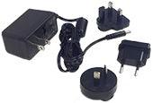 Ruby charger for handheld video magnifiers with interchangeable plugs and power adapter.