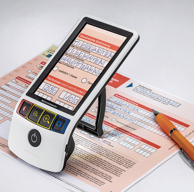 Smartlux Digital 5" portable HD video magnifier for low vision displaying text on paperwork.