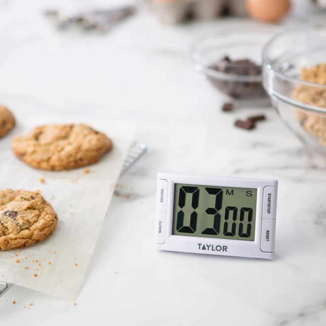 Super Readout Timer on marble countertop with cookies, oversized kitchen timer for low vision design.