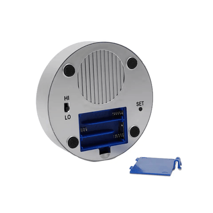 Talking clock with time and date announcement back view showing speaker and battery compartment.